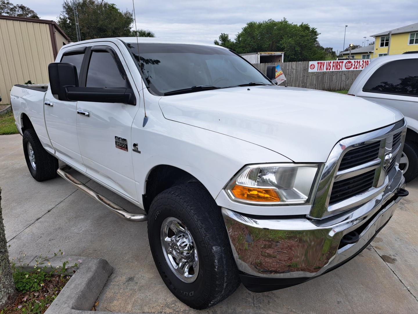 2011 White /BEIGE Dodge Ram 2500 Power Wagon Crew Cab 4WD (3D7UT2CL4BG) with an 6.7L L6 OHV 24V TURBO DIESEL engine, AUTOMATIC transmission, located at 1181 Aurora Rd, Melbourne, FL, 32935, (321) 241-1100, 28.132914, -80.639175 - Photo#2